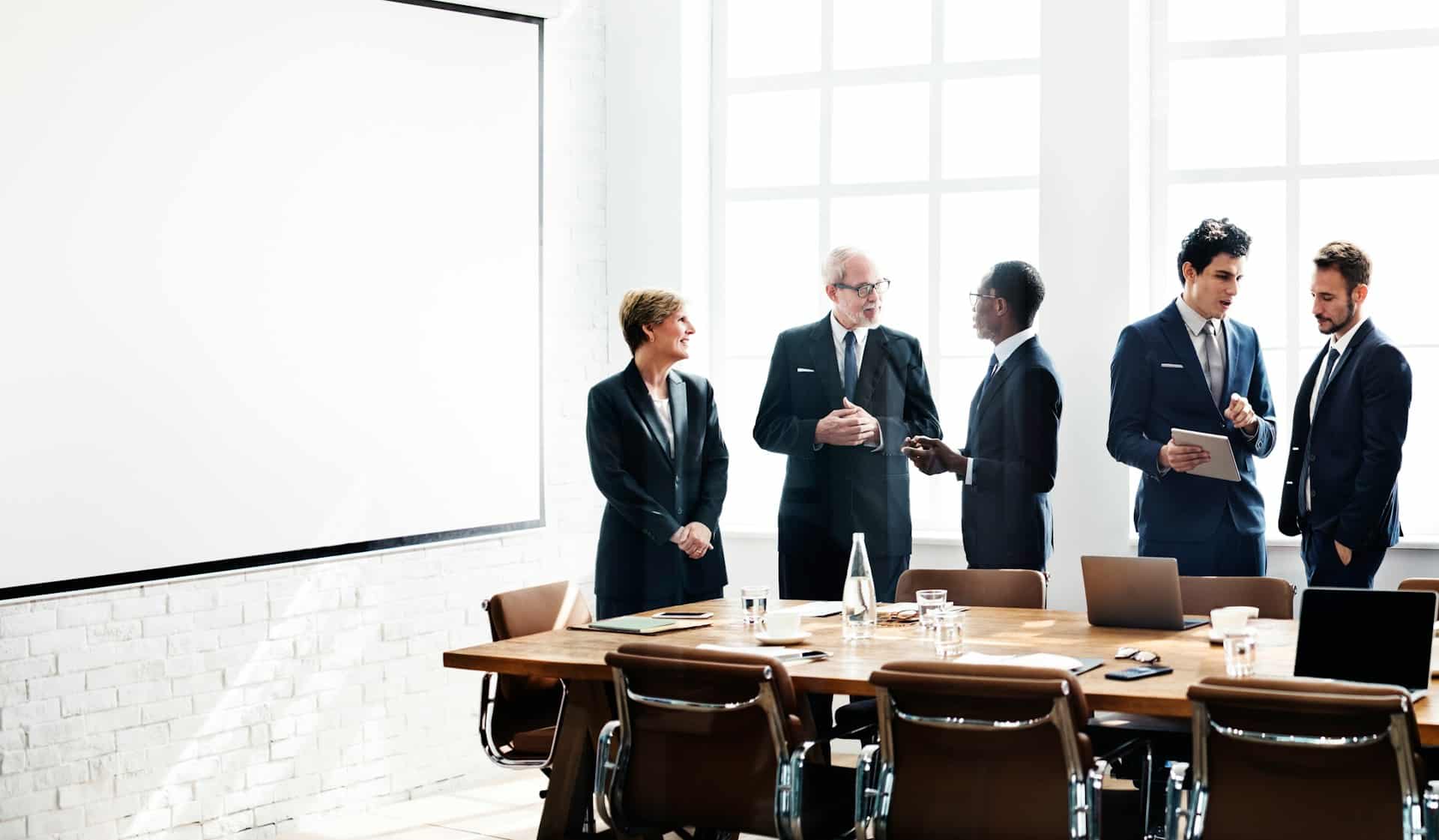 Business meeting with professionals in office setting.